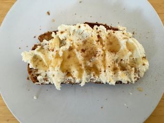 Eating toast with (homemade) ricotta and honey.