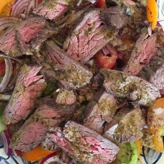 Flatiron steak with toasted spice vinaigrette.