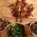 The roast chicken angel watches over its flock of side dishes.