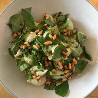 Pasta with peas, yoghurt, feta cheese, basil, and toasted pine nuts.