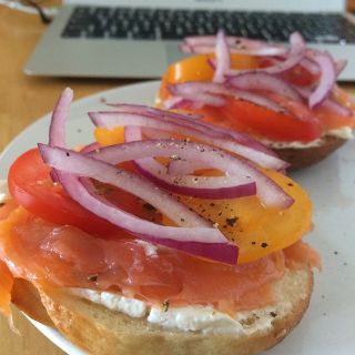 Smoked salmon, cream cheese, capers, onions and tomato on a homemade bagel.