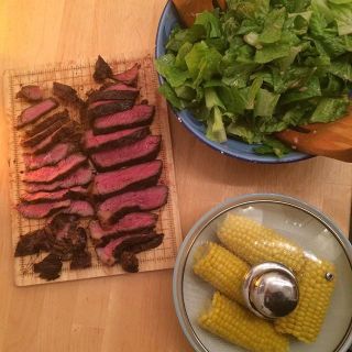 Steak, salad and corn.