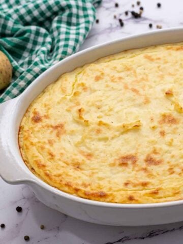 Baked Mashed Potato Casserole in White Casserole Dish