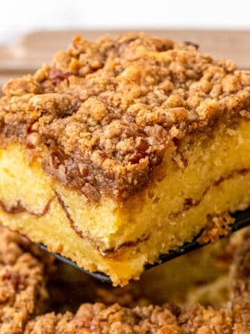 Slice of sour cream coffee cake on spatula.