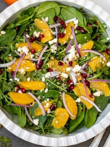 Mixed greens topped with pomegranate, oranges, toasted nuts and champagne vinaigrette.