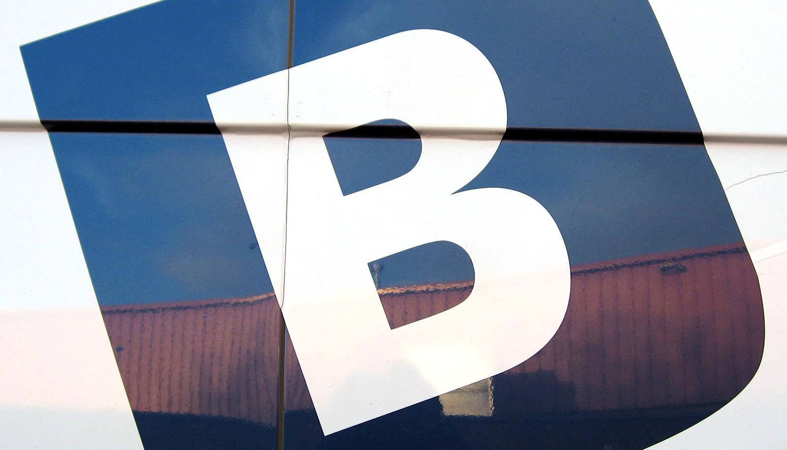 The letter B in white inside a black shape on a white background.