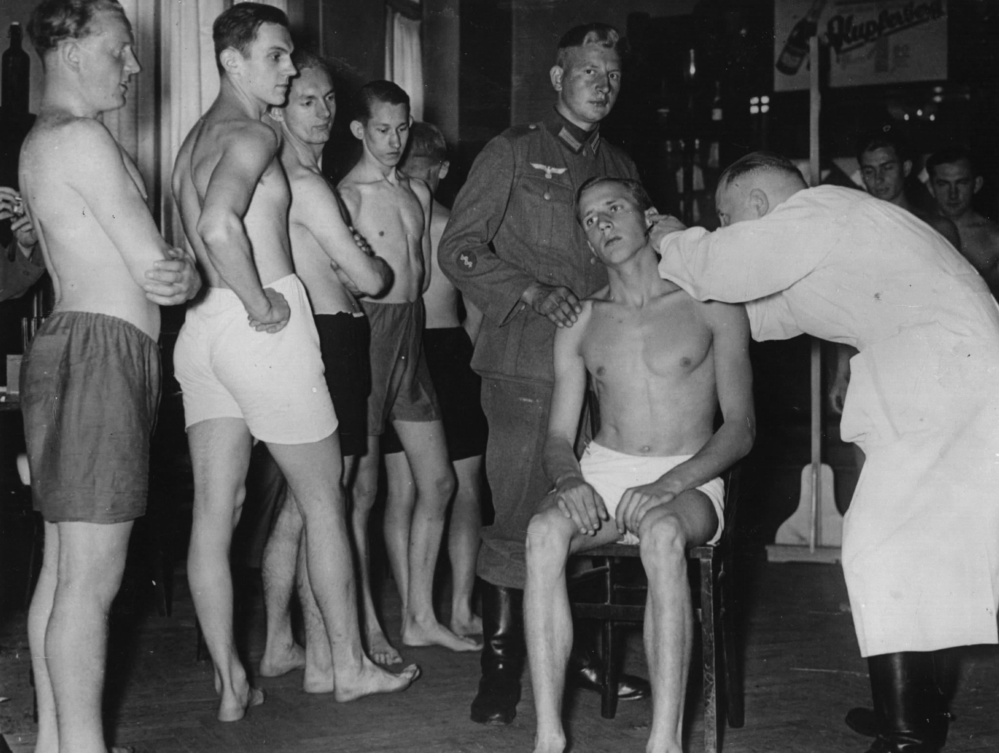 Young conscripted recruits undergo a medical examination in Berlin, Germany on June 22, 1937.