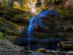 Sunlight on Rock Cliff Waterfall