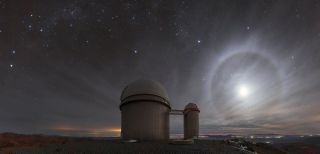 A lunar "halo" lights up the night sky above the 3.6-meter telescope at the La Silla Observatory in Chile. This phenomenon happens when the moon is at an altitude of about 22 degrees above the horizon, where light refracts through icy cirrus clouds. "Light rays that do this tend to 'bunch up' at the angle that represents the least amount of deviation from their original path. For the particular shape of ice crystal lurking within the cirrus clouds, this minimum deviation angle happens to be around 22 degrees," ESO officials said in a description.