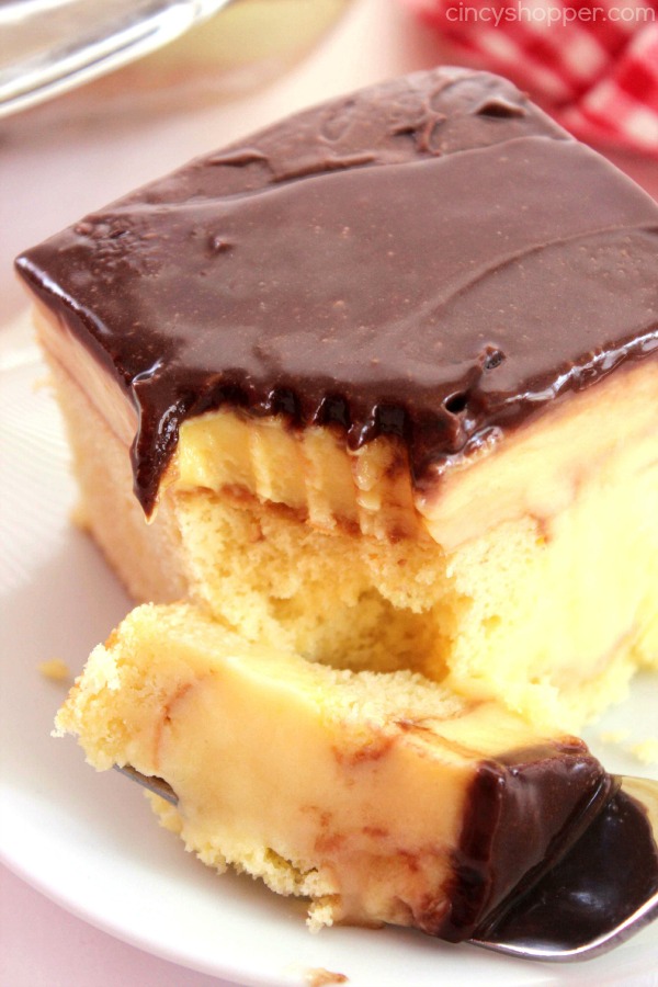 Boston Cream Poke Cake - so super simple and uses a boxed cake mix, pudding, and store bought frosting. Great for potlucks and summer bbq dessert.