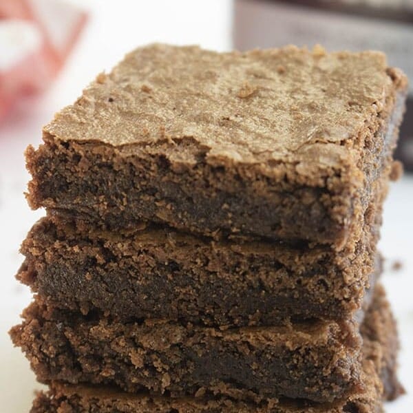 stack of Hershey brownies next to box of Hershey's cocoa powder