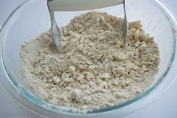 mid mixing of the dry and wet ingredients for the crisp in a large clear mixing bowl 