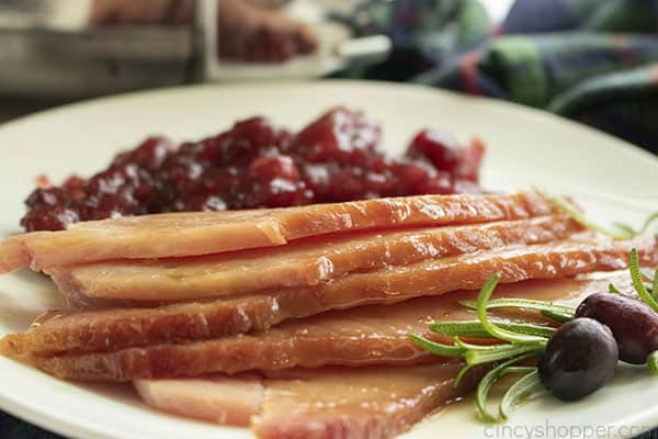 Slices of ham cooked in slow cooker on a plate