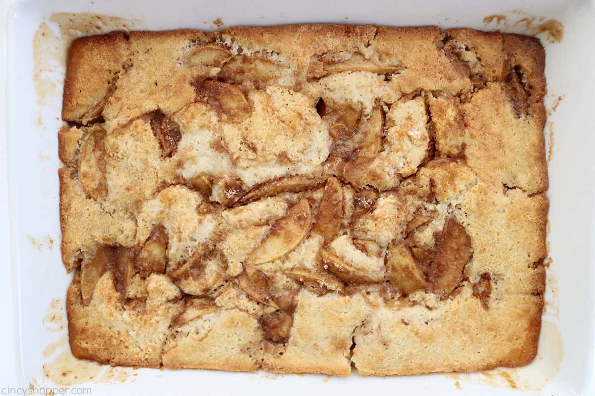 Fresh apple cobbler in a white baking dish.