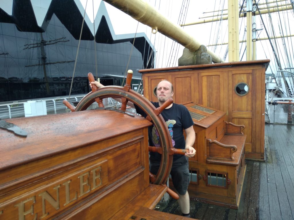 Dan at the wheel of the Glenlee