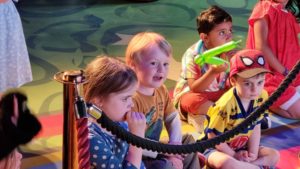 Children watching a show in the hotel.