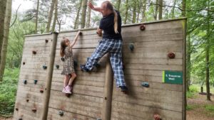 Dan on a climbing wall.