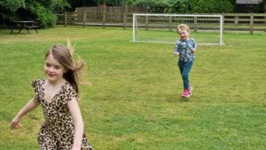 Running around on a football pitch.