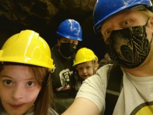 Dan, Ruth and the kids in a boat down a cave.