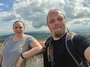 Ruth and Dan at the trig point at the summit of Pendle Hill.