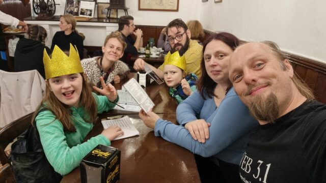 Dan, Ruth, and JTA with their children and a tour guide called Julie, enjoying churros in a Barcelona cafe.