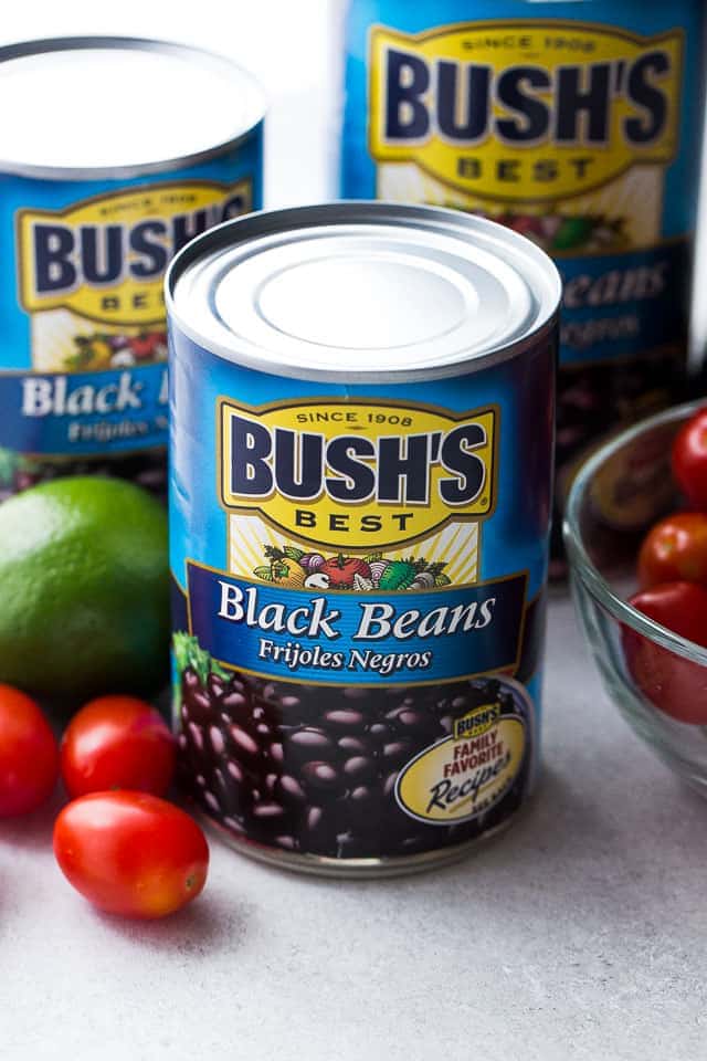 Close up of cans of Bush's black beans on a countertop.