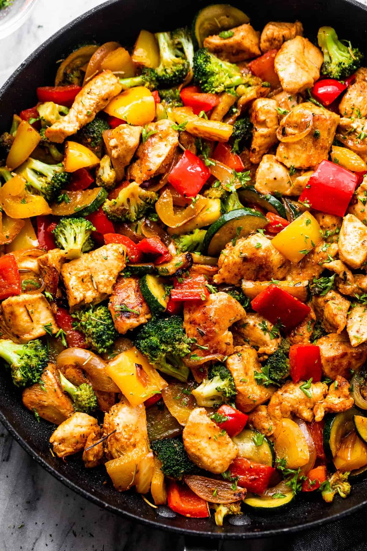 Chicken and Vegetables in a black skillet