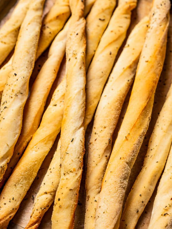 Close-up of golden-baked grissini breadsticks.