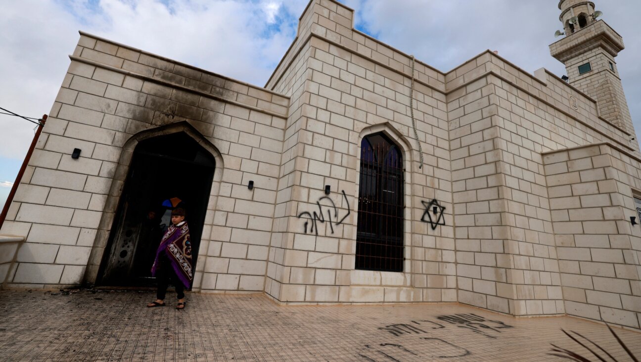 Palestinians inspect the damage done to a mosque after a reported attack by Israeli settlers in the West Bank town of Marda on Dec. 20, 2024. (Jaafar ASHTIYEH / AFP)