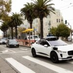 A Waymo autonomous vehicle on Market Street in San Francisco