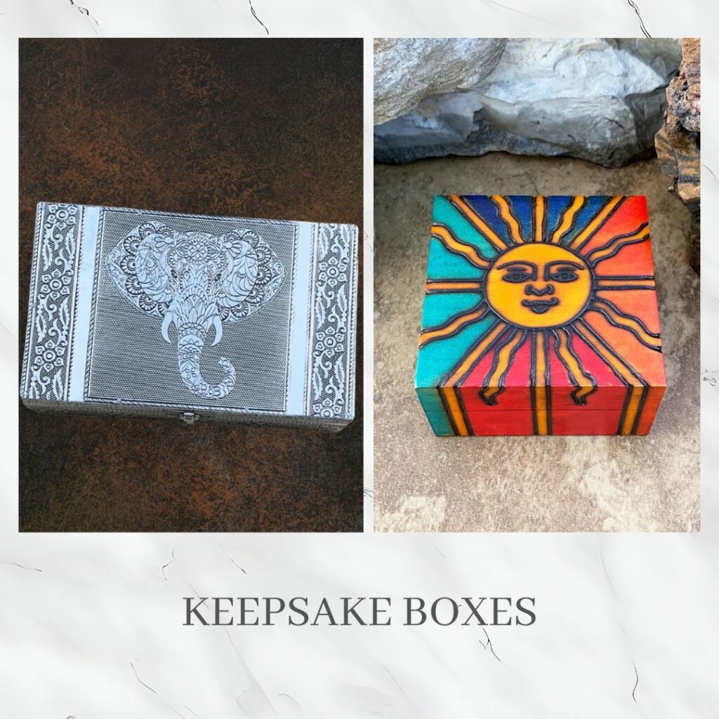 An image of a hammered tin box with elephant head and a petite brilliant sun handcarved wood box. The link to this image takes you to all of our boxes.