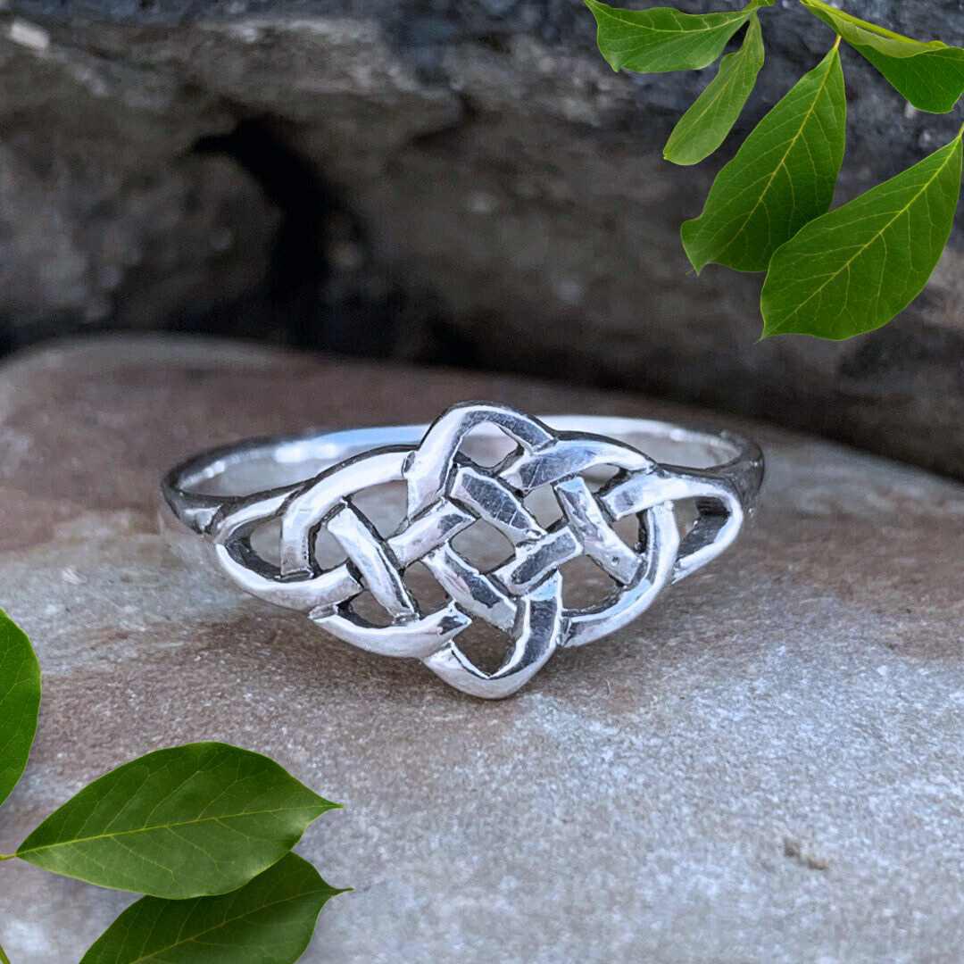 an image of a lovely Sterling Silver Celtic Knot Ring with the open knots spreading out in a Marquise shape