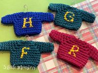 Crochet Weasley sweaters from Harry Potter to hang on your tree. Little sweaters with an initial on the front just like Molly Weasley made.