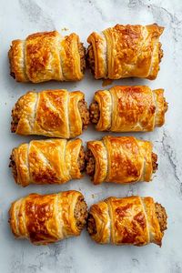 Once you try these British sausage rolls, you'll be hooked! With pork sausage, herb seasonings, and puff pastry, they're crispy and delicious.