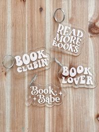 Bookish keychains - the perfect accessory for any book lover! Engraved on clear acrylic, these keychains are a great addition to a book tote or any keychain