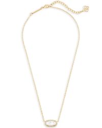 A dainty stone and delicate metallic chain combine to create the Elisa Gold Pendant Necklace in Ivory Mother-of-Pearl, your new favorite wear-anywhere accessory (and our June birthstone!). This pendant necklace can be paired with any look, providing that extra touch of timeless style. Make the Elisa Pendant Necklace a staple in your wardrobe and you will not be disappointed.Size: 0.38"L x 0.63"W, 15" chain with 2" extender