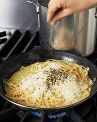 Everyone’s an expert when it comes to this sublime amalgam of pasta, cheese, and black pepper. Some cooks prefer to simply toss hot pasta with Pecorino Romano in the age-old way. Others like to create a creamy pan sauce, relying primarily on Grana Padano, which, unlike Pecorino, melts beautifully. We’re in the latter camp (and we up the ante by adding the brightness of lemon), but that means technique is all-important.