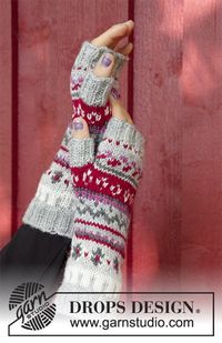 The set consists of: Knitted jumper with round yoke, multi-colored Norwegian pattern and A-shape, worked top down. Sizes S - XXXL. Wrist warmers with multi-colored Norwegian pattern. The set is worked in DROPS Karisma.