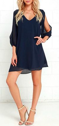 Lulus Exclusive! When it's time to shift your gears into glamor mode, the Shifting Dears Navy Blue Long Sleeve Dress is our most dearly beloved dress! Navy blue chiffon forms a roomy shift silhouette with a deep, scoop neckline and a flared shape that flows into an asymmetrical, concave hemline. Long, sheer sleeves have on-trend, cold shoulder cutouts that open all the way to the cuffs. #lovelulus