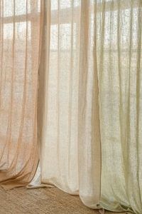 We love the subtle texture of linen curtains and the cozy vibe they bring to the space!