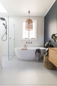 Room tour: A stunning deep blue, coastal luxe bathroom