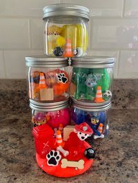 Paw Patrol Playdough Sensory Jars! Makes a great small gift or party favor! 🐶 Each plastic jar includes: 🐾 3oz play-doh (the good stuff) 🐾 1 Paw Patrol figurine  🐾 Paw Patrol-themed trinkets* 🦴 Glitter is added to the play-doh unless otherwise specified! 🦴 *Optional ($1 add on) to add the mini recycling bin!  🦴 Figurine will be random unless otherwise requested. Jars may vary based on current availability.  WARNING: Choking Hazard! Contains small parts. Not recommended for children under