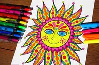 Hippie Sun coloring page from Thaneeya McArdle's Peace & Love Coloring Book, colored in with highlighters