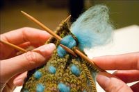 "This technique is known as thrumming and it works to create an extra layer of insulation. Thrum is sheep’s wool that has been separated into wisps rather than being spun into knitting yarn." via knittingyarn.com