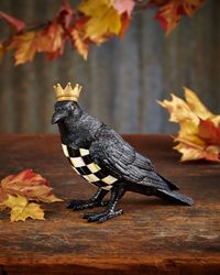 With his golden crown and Courtly Check breast, our Crowned Crow is really something to caw about. Go beyond ghouls and goblins with this unique autumn accessory that’s as stylish as it spooky. We love him keeping an eye on your annual costume party from atop the mantel, or peeking out on trick-or-treaters from his perch on the entry-hall table. Crowned Crow Figure by MacKenzie-Childs - 8.75"W x 4"D x 7.25"T