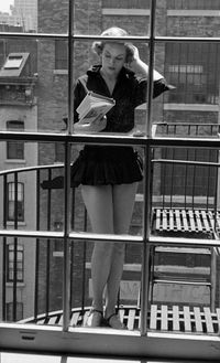 City reading on balcony. “A good book is an education of the heart. It enlarges your sense of human possibility, what human nature is, of wh...