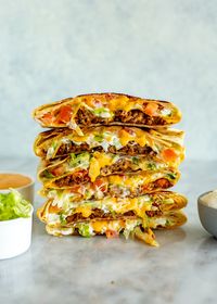 This Copycat Taco Bell Crunchwrap Supreme tastes just like the real deal! It's super crispy and loaded with taco meat, veggies and cheese.