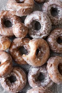 Soft, fluffy and tender old fashioned sour cream doughnuts are fried to perfection and coated in sweet vanilla glaze. These stay soft for days, and are a perfect weekend baking project for the holidays or Christmas break!