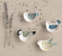 This adorably handpainted stoneware bird shaped trinket dish makes a sweet little gift for yourself or someone special. There are 4 styles. Each style is numbered for easier ordering. 3-3/4"L - 4-1/4"L Hand-Painted Stoneware Bird Shaped Dish Food Safe