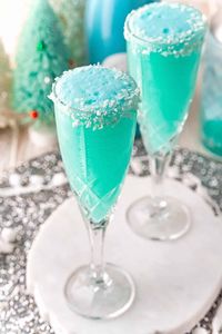 A gorgeous hue of blue, a Jack Frost mimosa, with its frosty rim of coconut,  is a spectacular addition to your brunch or holiday party.